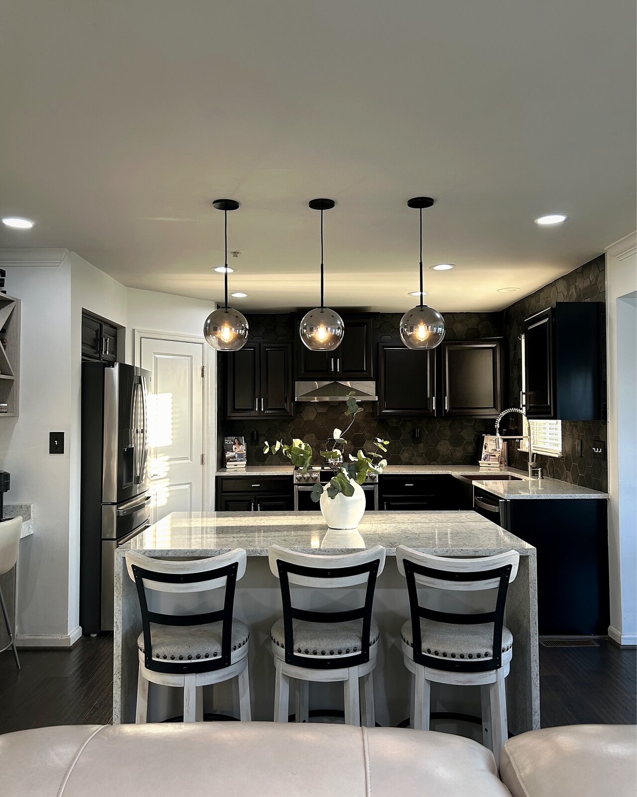 Kitchen after renovation with pendant lighting