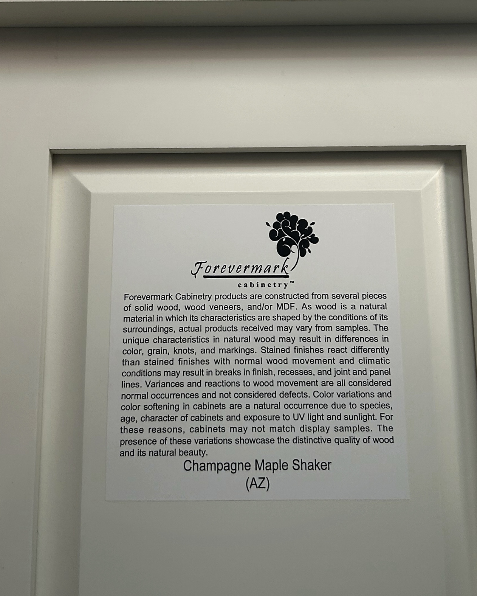 Forevermark Cabinetry label for the Champagne Maple Shaker line
