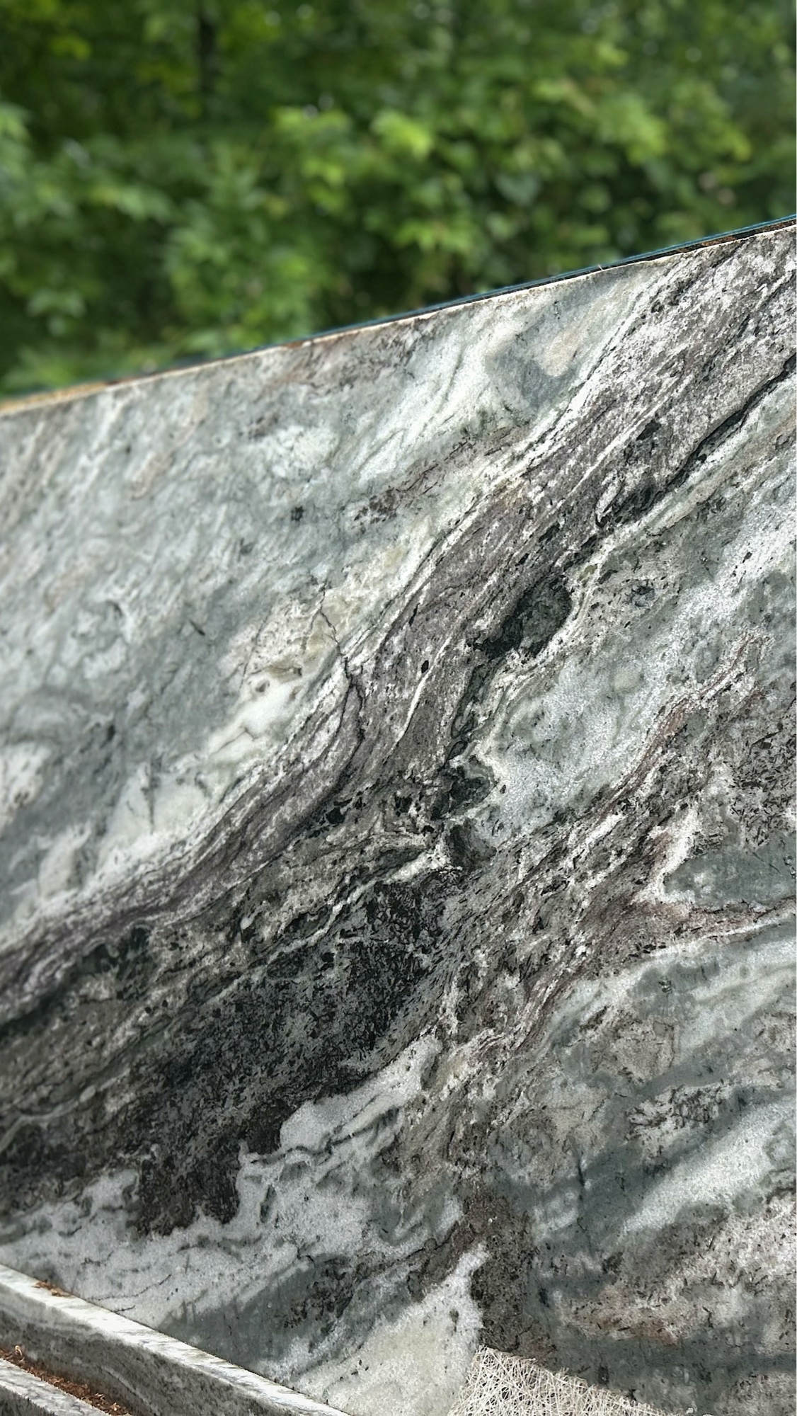 Brown Fantasy marble slab — dramatic gray and graphite veining on a warm ground