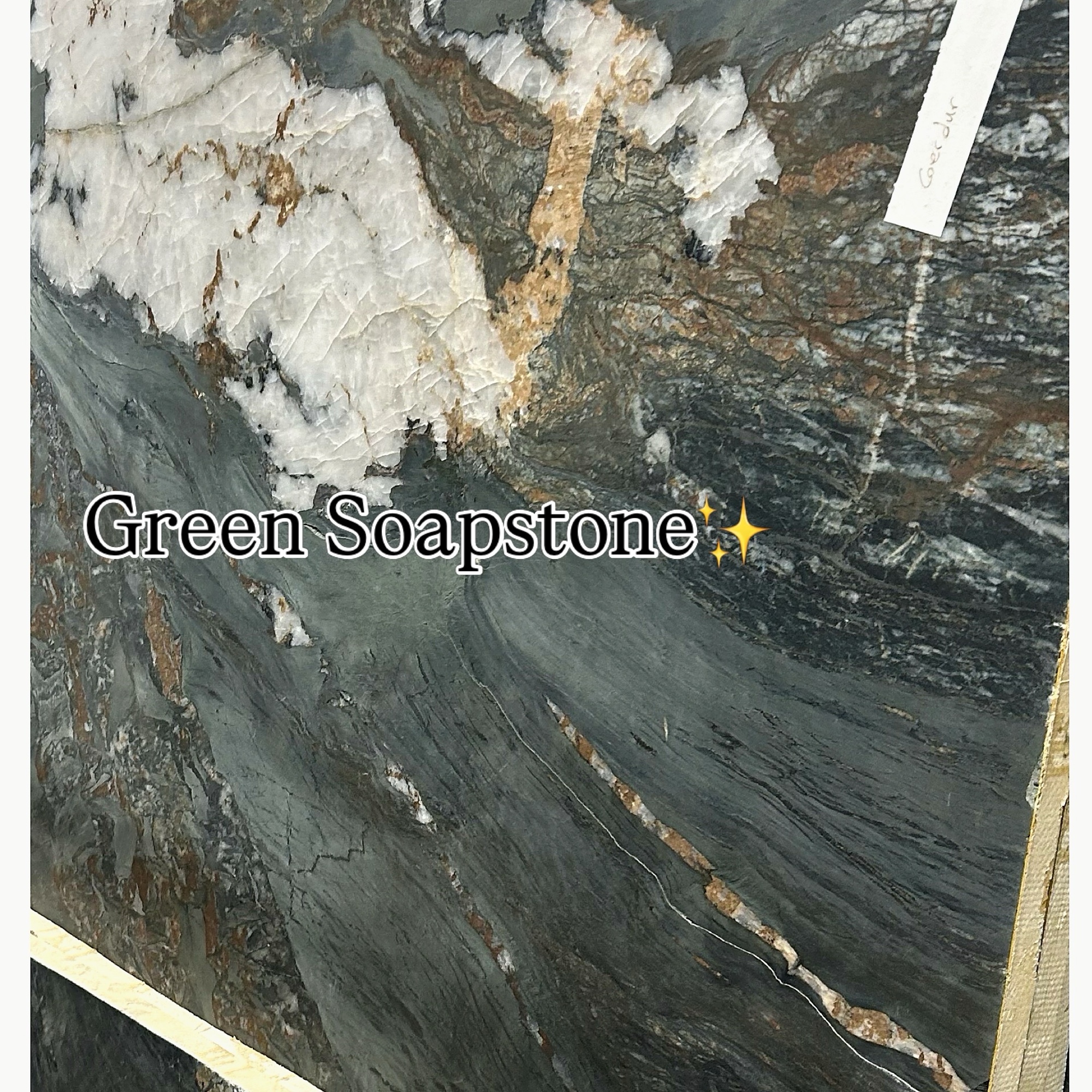 Green soapstone slab with dramatic white and copper veining