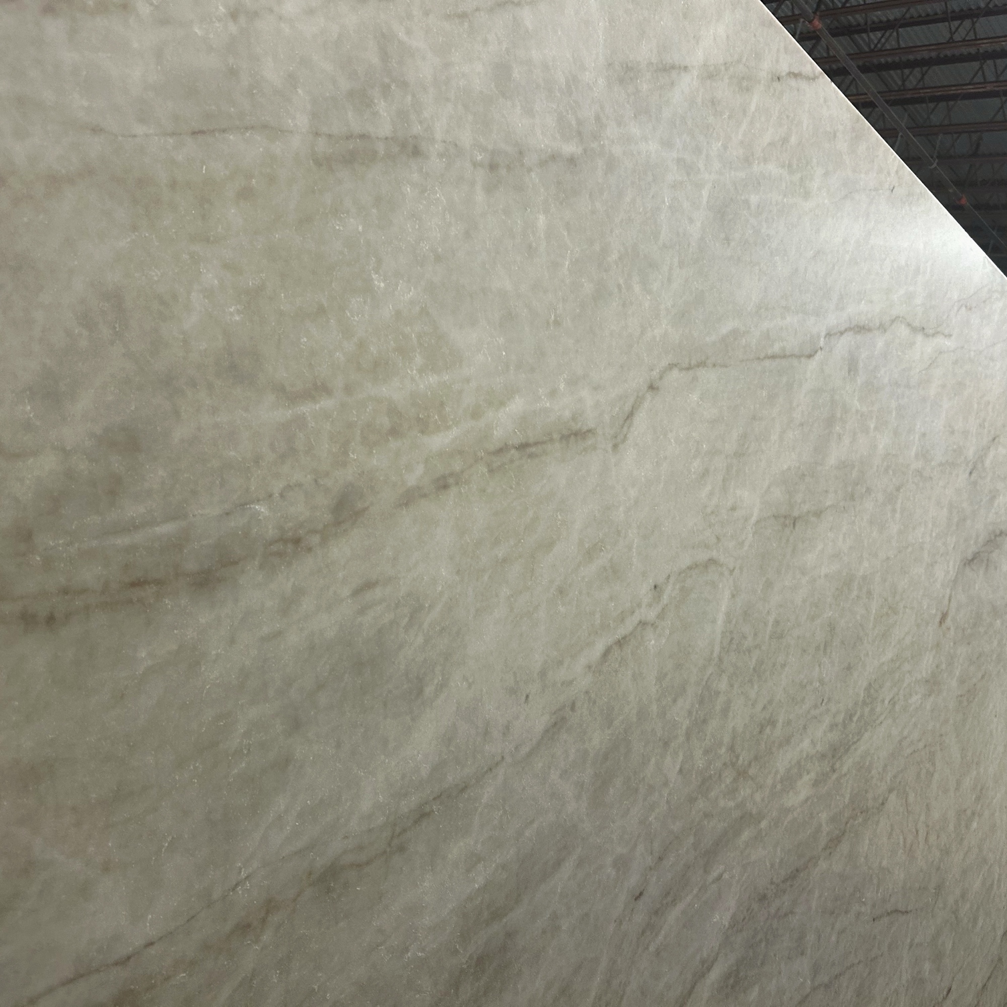 Taj Mahal quartzite slab — creamy ivory with soft taupe veining